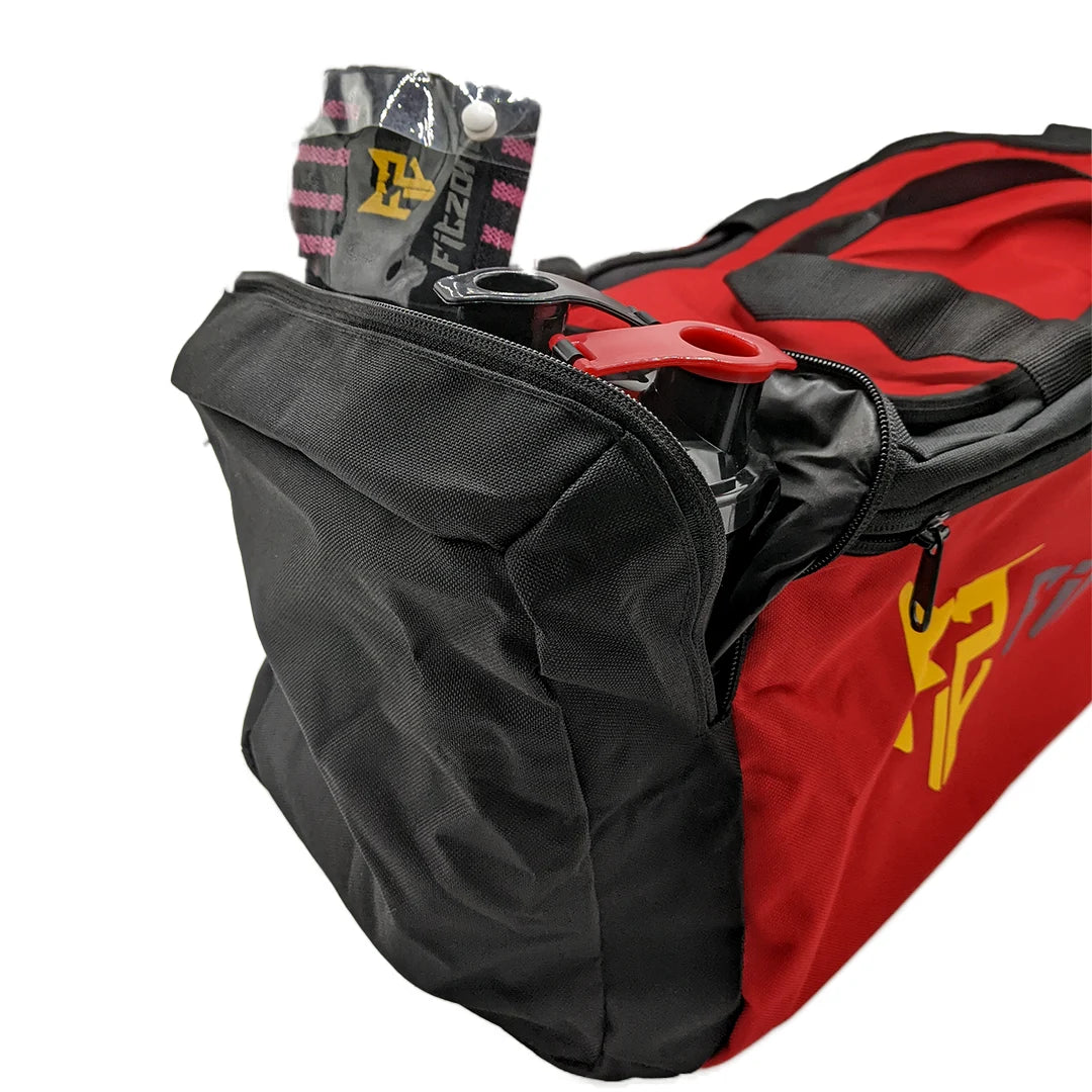 Red and black sports bag with visible brand logo on a white background