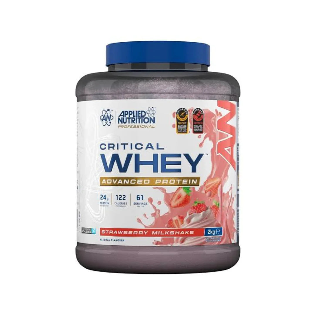 A 20kg tub of Applied Nutrition Critical Whey Advanced Protein in Strawberry Milkshake flavor, featuring a dark translucent container, blue cap, and a white label with pink and blue graphics.